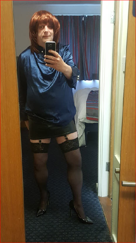 Sissy Charlotte exposes stocking tops in short skirt