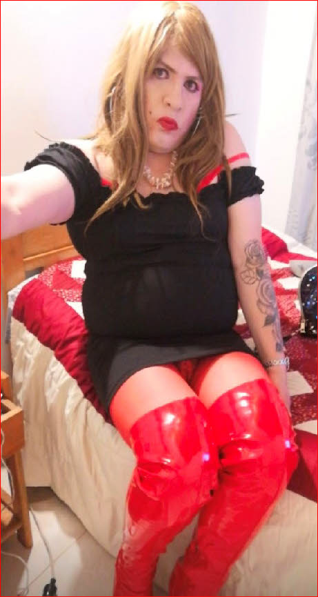 Closet sissy Johana wears little black dress and red thigh boots