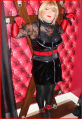 Cross-dresser bound to cross in domme's chambers