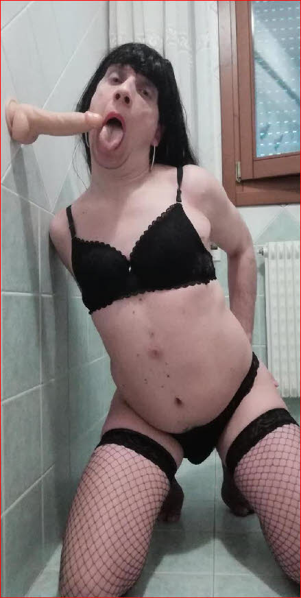 Slutty sissy whore Dania opens wide to suck huge dildo