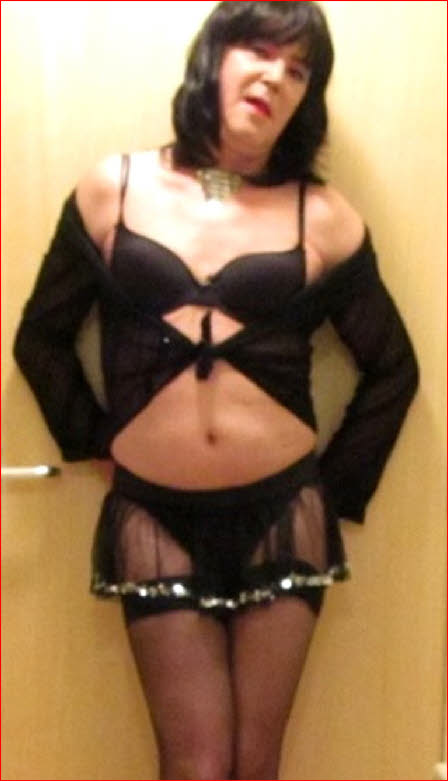 Cross-dressing sissy John with throbbing erection