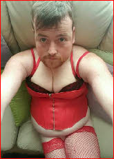Bearded loser Sissy Jenna in red corset and stockings